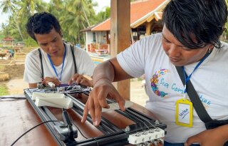 Wira and Wilan playing the Magnesynth at Dinacon Bali 2025